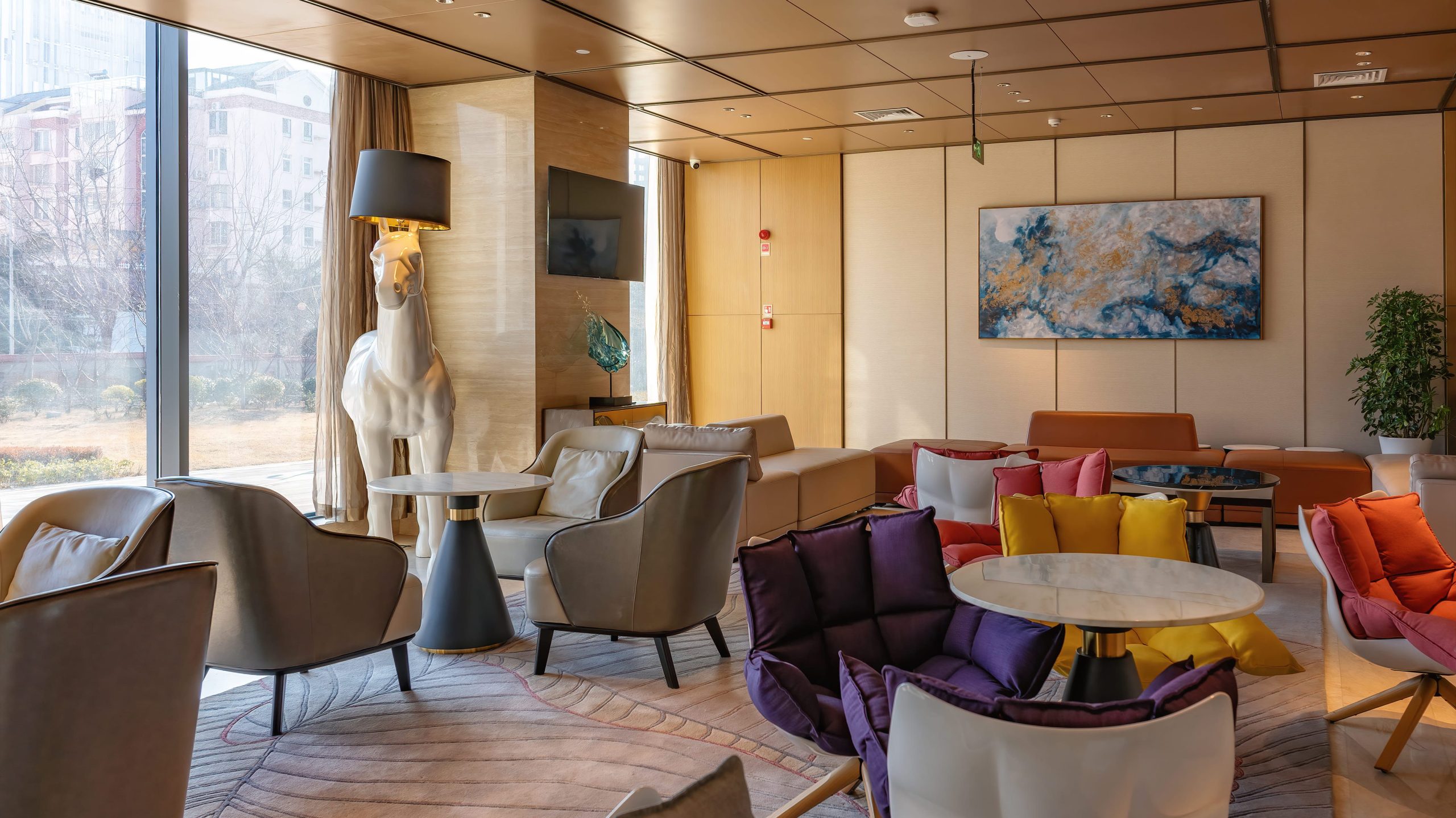 Most comfortable lounge chair in an office break room with modern design, fabric and leather options, offering comfort and durability for employees.